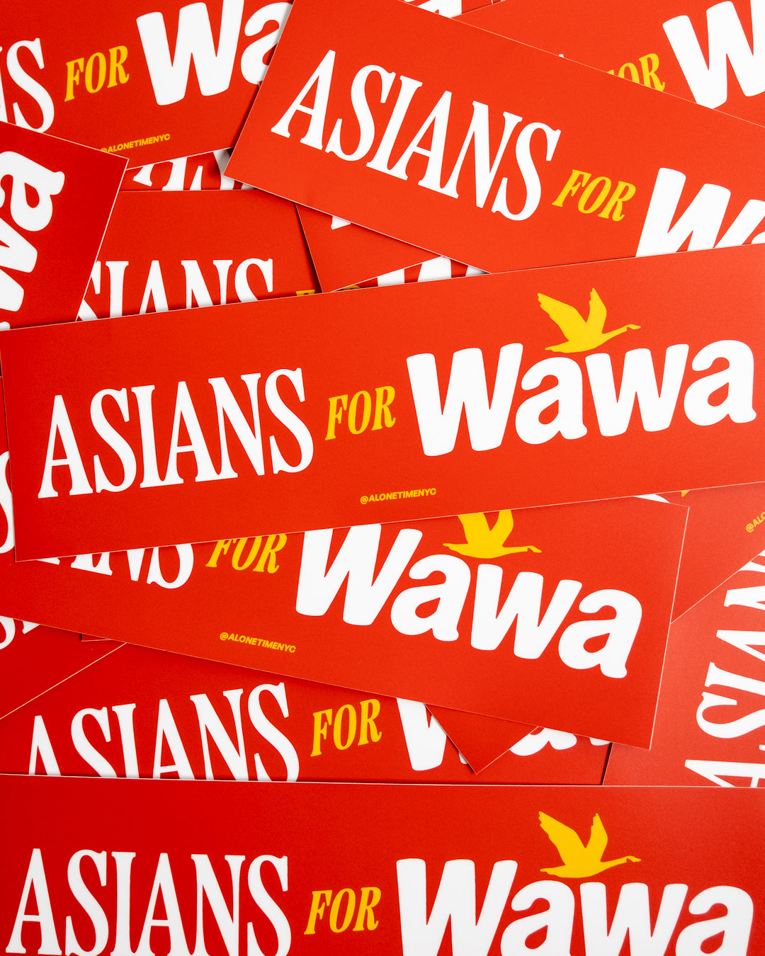 A pile of red rectangular bumper stickers featuring the text 'ASIANS FOR Wawa' in white and yellow, with a small yellow bird logo.