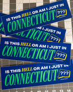 Four blue rectangular bumper stickers with the text 'IS THIS HELL OR AM I JUST IN CONNECTICUT' in white and green, plus a yellow outlined CT state shape with '???'. The stickers are stacked on a gridded cutting mat background.